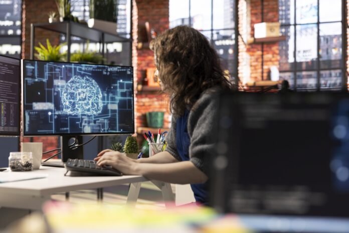 Teleworking developer using computer for artificial intelligence computing