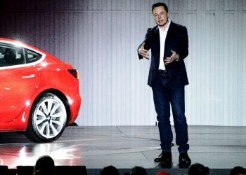 Elon Musk presenting Tesla's first mass market vehicle, the Model 3, in 2017