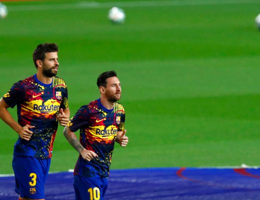 Barcelona's Lionel Messi, right, warms up with Gerard Pique.