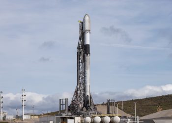 A SpaceX Falcon 9 rocket stands ready to launch the Starlink 7-14 mission from Vandenberg Space Force Base. Image
