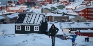 A man walks along a road on the day of the meeting between top US officials and the foreign ministers of Denmark and Greenland, in Nuuk, Greenland, on January 1