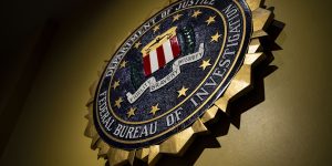 The seal of the Federal Bureau of Investigation hangs on a wall at the FBI headquarters in Washington on June 14, 2018