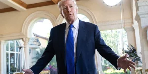 s Donald Trump wearing blue suit and tie