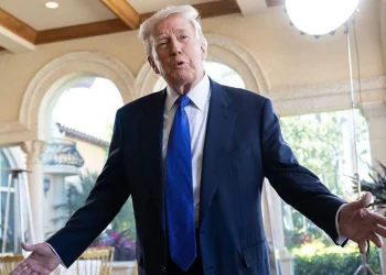 s Donald Trump wearing blue suit and tie