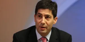 Kevin Warsh, a white man with dark hair wearing a suit.