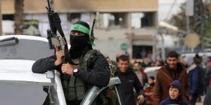A Palestinian fighter from the Ezzedine al-Qassam Brigades, the armed wing of Hamas, takes part in the funeral procession of Marwan Issa, a top Hamas commander