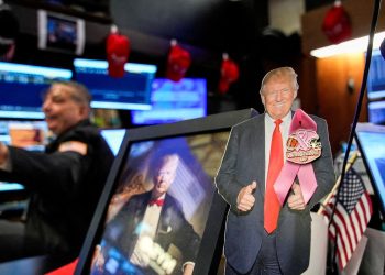 Traders work on the floor at the New York Stock Exchange (NYSE) in New York