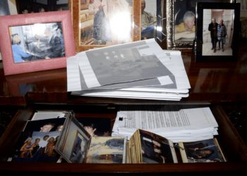 of Jeffrey Epstein's desk features an infamous picture of Donald Trump smiling with then-girlfriend Melania, Epstein, and Ghislaine Maxwell. Another image in th