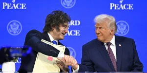 Argentine President Javier Milei shakes hands with U.S. President Donald Trump at a meeting of Trump’s “Board of Peace” during the World Economic Forum annual m