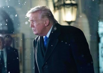 President Donald Trump speaks to reporters as he walks in the South Lawn before departing the White House, on Friday, February 6, in Washington, DC