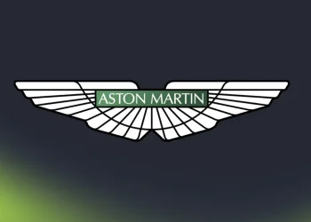 A large Aston Martin logo against a dark background