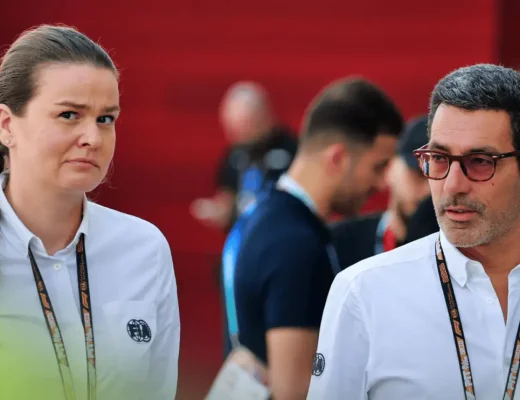 Claire Dubbelman and Rui Marques walk through the paddock in Qatar
