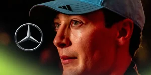 George Russell pictured at the 2025 Qatar Grand Prix, as a Mercedes logo appears on the left