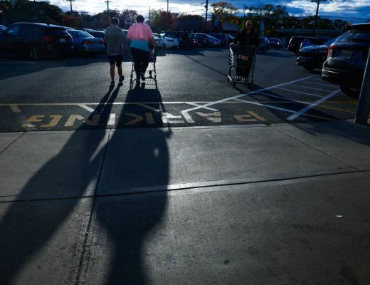 Shoppers walk outside a grocery store in Bergenfield, New Jersey, on October 24.