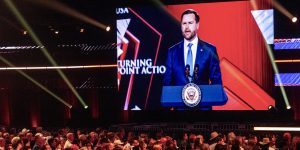 A projection of Vice President JD Vance speaking at Turning Point event in Phoenix