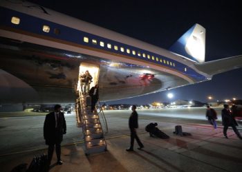 People disembark from Air Force One after returning to Joint Base Andrews