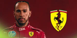 Lewis Hamilton poses in Ferrari overalls with a cracked Ferrari logo alongside him against a red background