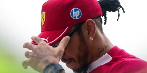 Ferrari driver Lewis Hamilton puts his hand to his face at the 2025 Qatar Grand Prix