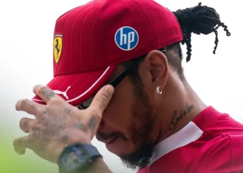 Ferrari driver Lewis Hamilton puts his hand to his face at the 2025 Qatar Grand Prix