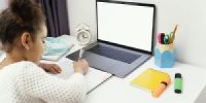 little-girl-home-online-school-using-laptop