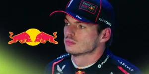 Max Verstappen pictured at the 2025 Qatar Grand Prix, as a Red Bull logo appears on the left