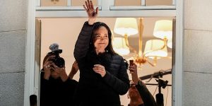 Maria Corina Machado waves