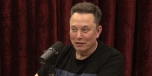 Elon Musk speaking into a microphone.
