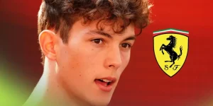 Oliver Bearman pictured at the 2025 Abu Dhabi Grand Prix, as a Ferrari logo appears on the right
