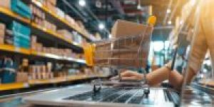 person-setting-up-online-store-uploading-products-laptop