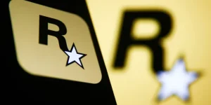 rocstar-games-logo-displayed-on-a-phone-screen-and-rockstar-games-logo-displayed-on-a-laptop